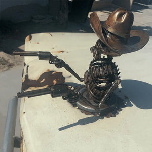 Pistolsigtende cowboyskelet kølerhjelmsdekoration
